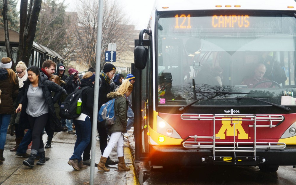 Students boarding a Gopher Trip bus